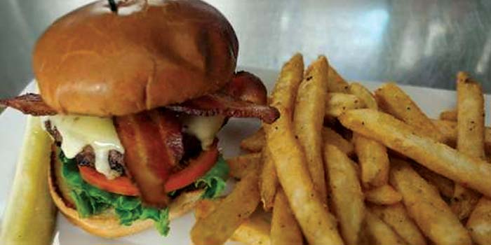 Enjoy Concord's best burger! Served with fries at Cheer's Grille & Bar,