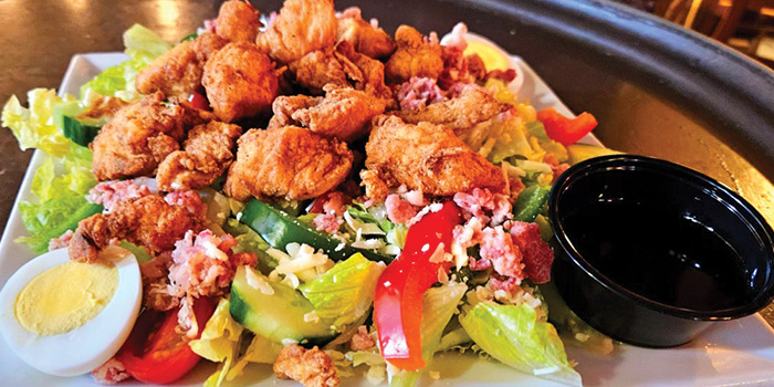 Chicken salad over lettuce made famous by Cheers Bar & Grill in Concord new Hampshire.